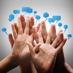 several people are holding their hands together with speech bubbles floating above them and smiling faces drawn on the fingers