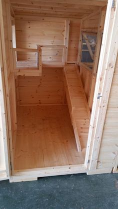 the inside of a wooden sauna with no doors