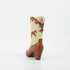 1950's Inspired Bucking Horse Adorned Western Boots. Proud To Be 100% Vegan Friendly. Upper Material: Faux Textured Leather Lining: Man Made + Fabric Step In Boot w/ Inner Tab For Easy Access. Heel Height: 3" Inches Approximate Shaft Height: (based on size 6 from top to back counter) 7 1/2" Inches / Mid Calf Height Fits True To Size, Please Size Up 1/2 If You Take A Wider Width. For Any Sizing Suggestions, Please Contact Customer Care. Imported Vintage Fitted Heeled Boots For Rodeo, Retro Spring Heeled Boots With Pointed Toe, Retro Styled Pointed Toe Fitted Heeled Boots, Retro Style Fitted Heeled Boots With Pointed Toe, Retro Fitted Heeled Boots With Pointed Toe, Retro Styled Fitted Heeled Boots With Pointed Toe, Retro High Heel Fitted Boots, Retro Fitted High Heel Boots, Retro Fitted High Heeled Boots