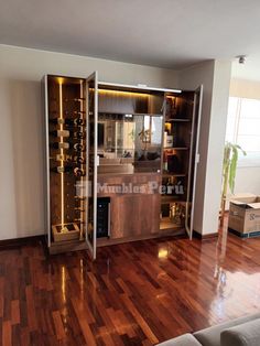 a living room filled with furniture and wooden floors