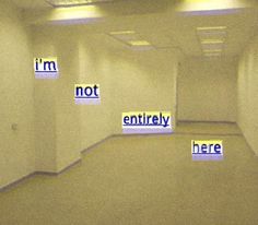 an empty parking garage with no entry signs on the walls and words written in blue