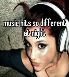 a woman with headphones on her face and the words music hits so different at night