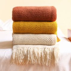 three blankets stacked on top of each other