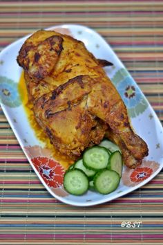 a chicken with cucumbers on a plate