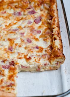 a square pizza sitting on top of a metal pan