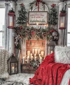 a living room decorated for christmas with candles and decorations