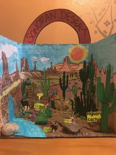 a desert scene made out of construction paper