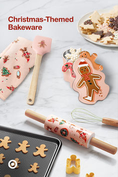 christmas themed baking utensils and cookies on a table