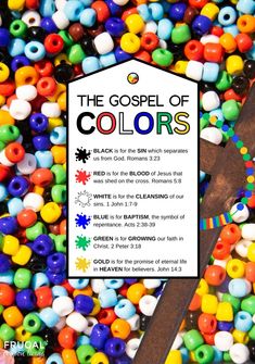 a cross surrounded by colorful beads and a sign that says the gospel of colors on it