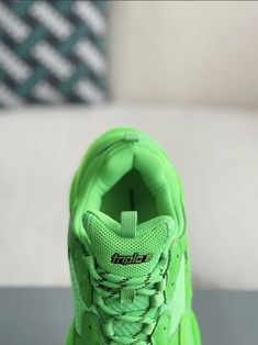 Turn heads and break boundaries with these neon green Balenciaga Triple S-inspired sneakers. The electrifying colorway and signature chunky sole make a bold statement, while the premium materials ensure lasting comfort. Embrace the avant-garde and step into the future of footwear. Green High-top Sneakers Medium Fit, Green High-top Sneakers With Medium Fit, Green High-top Sneakers, Green Low-top Running Shoes With Translucent Outsole, Green Running Shoes With Branded Insole And Medium Fit, Green Functional Sneakers For Streetwear, Functional Green Sneakers For Streetwear, Functional Green Sneakers With Abzorb Midsole, Green Functional Sneakers With Boost Midsole