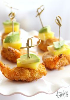 small appetizers are arranged on a white plate