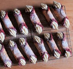 there are many desserts on the rack ready to be eaten and served for consumption