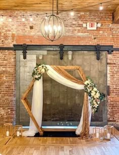 a wedding ceremony setup in an old brick building