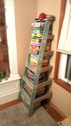 an old ladder is used as a bookshelf to hold children's books