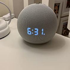 an alarm clock sitting on top of a table