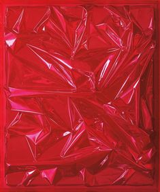 an abstract red painting with many pieces of plastic on the bottom and bottom, all in different shapes and sizes