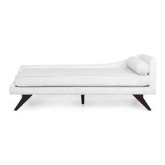 a white chaise lounger with pillows on it's back and legs, in front of a white background