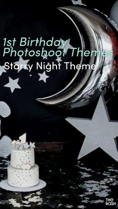 a white cake sitting on top of a table next to stars and moon decorations with the words 1st birthday photoshop themes starr night theme