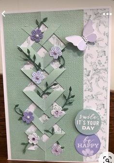 a card with flowers and butterflies on it