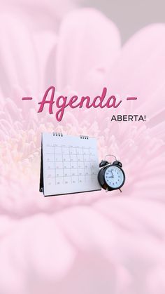 a pink flower with an alarm clock on it and the words agenda written in spanish