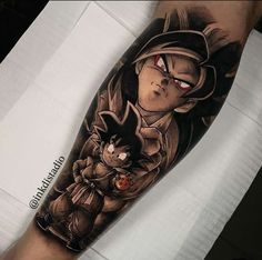 a man with a tattoo on his arm that has an image of the character and cat