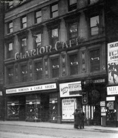 an old black and white photo of the exterior of a store called gladlor cat