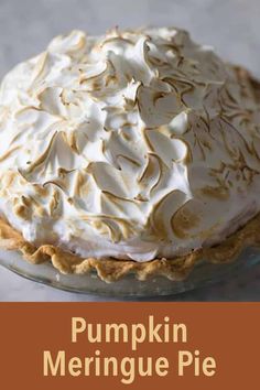 a pumpkin meringue pie on a plate with the words pumpkin meringue pie