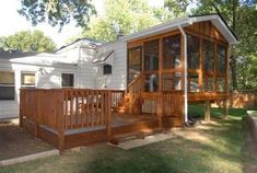 a house with a deck and screened porch