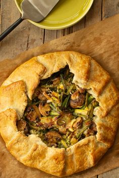 a Savory Asparagus and Ricotta Galette on a piece of brown parchment paper next to green plates Ricotta Galette, Galette Recipe, Yoghurt Cake, Savory Pastry, Winter Vegetables, Quick Bread Recipes, Creamy Cheese, Asparagus Recipe, Crust Recipe