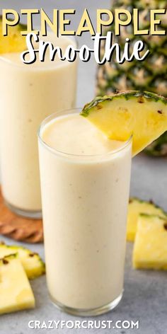 two glasses filled with pineapple smoothie on top of a table