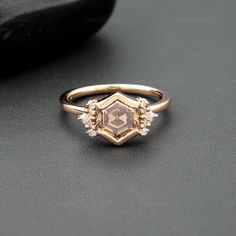 a diamond ring sitting on top of a table