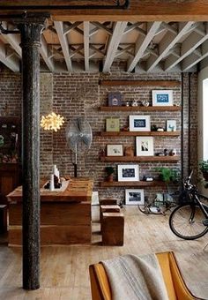 a living room filled with furniture and lots of shelves