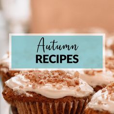 cupcakes with white frosting and cinnamon sprinkles on top are sitting on a plate