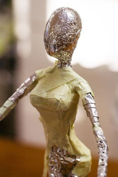 a paper mache figure is displayed on a table