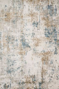 an area rug with various colors and patterns on it, including blue, brown, beige and white