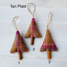 three small christmas trees made out of fabric