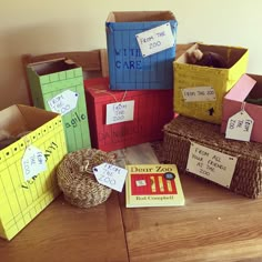 several cardboard boxes are stacked on top of each other and labeled with numbers, words, and pictures