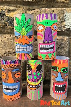 four different colored paper cups with faces painted on them and the words red ted art written in