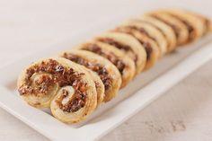 a white plate topped with cookies on top of a table