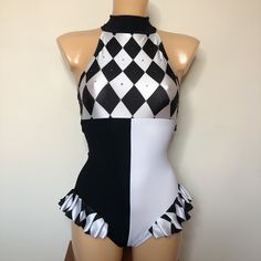 a mannequin wearing a black and white checkered swimsuit