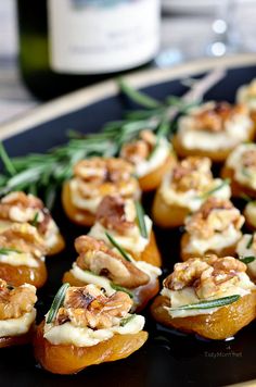 an image of some appetizers with blue cheese and croutons on them