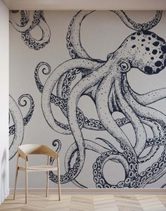 an octopus wallpaper mural in a room with a chair and wooden floored floors