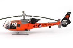 an orange and black helicopter is on a white background with the words royal navy printed on it