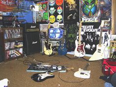 a room filled with guitars and other musical equipment