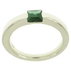 Very stylish modern band ring crafted in 9k white gold featuring at the centre a square cut natural green tourmaline. The dimension of the gemstone is 5 x 5 millimeters / 0.196 x 0.196 inches. This ring is also available with square cut gold topaz in 9 karat rose gold (1stDibs Ref: LU126214706422) and together they can be worn as stacking rings. Us finger size 6.5 / Italian size 13 / French size 53. Adjustable to the customer's size before shipping. Handmade in Italy by Botta Gioielli and marked Green Tourmaline Jewelry, Ruby Eternity Band, Gold Topaz, Tourmaline Jewelry, Eternity Band Ring, Rose Gold Band, Gold Band Ring, Ring Crafts, Modern Ring