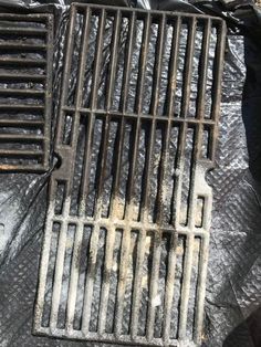 an iron grate sitting on top of a tarp