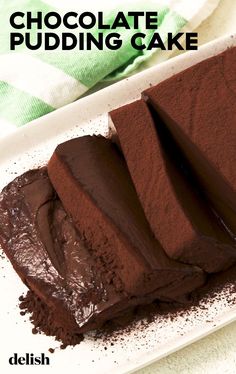 chocolate pudding cake sitting on top of a white plate