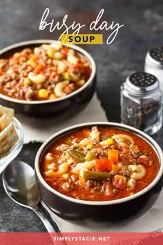 two bowls filled with soup on top of a table