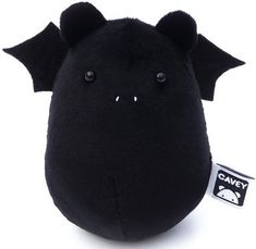 a black bat shaped stuffed animal on a white background with a tag that says cavey