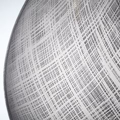 a close up view of a vase with lines on it